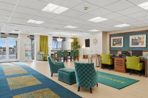 a waiting room with chairs and a table at Hollywood Beach Tower in Hollywood