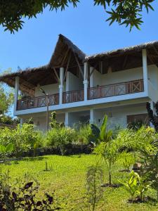 a view of the hotel from the garden at Mahé Lodge, Nosy Be in Nosy Be