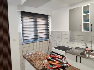 a kitchen with a counter top and a sink at Kravica Oasis in Ljubuški