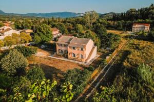 an aerial view of a house with a yard at Marina Studios in Sidari