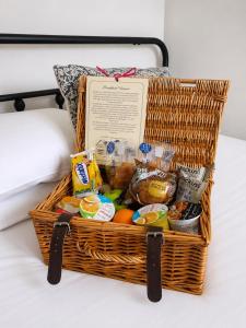 a basket filled with food on a bed at The Kensington in Great Yarmouth