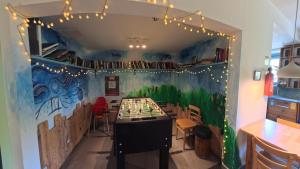 a room with a chess game on the wall at Babelfish Hostel in Würzburg
