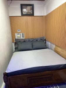 a bed in a small room with at LALEAH Transient House in Cotabato