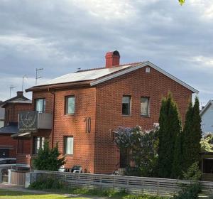 a brick building with a chimney on top of it at Lk Apartments in Halmstad