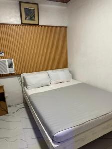 a large bed in a room with at LALEAH Transient House in Cotabato +6 photos