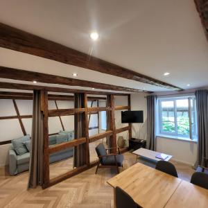 a living room with a table and a couch at Le FENUA in Colmar