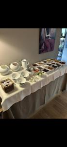 a table with a buffet of food on it at Pension Hauenstein in Lagundo +28 photos
