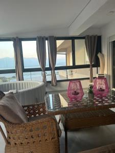 a living room with two lamps on a table at Mila Todorovska in Star Dojran
