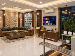 a lobby of a hotel with a waiting room at Castal Blue Hotel Near IGI Delhi Airport - Free Breakfast and Dinner complementry in New Delhi