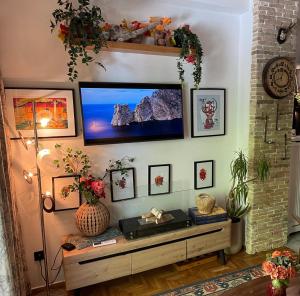 a living room with a flat screen tv on a wall at Avant-Garde Studio in Athens +5 photos