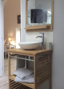 a bathroom with a sink and a mirror at Chez Karen in Montlay-en-Auxois +35 photos