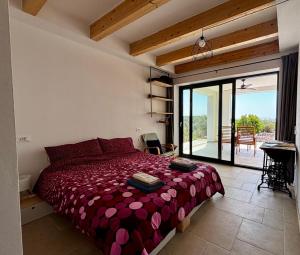 a bedroom with a large bed and a balcony at BnB Paradiso in Carloforte +15 photos