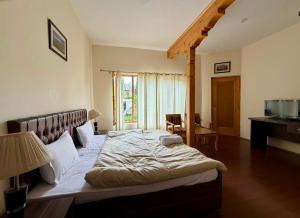 a bedroom with a large bed in a room at Niri-la Ladakh Leh in Leh