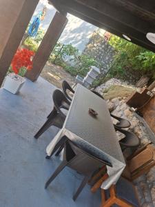 a tv sitting on top of chairs on a porch at Vikendica DUNAV in Golubac