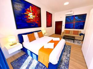 a bedroom with a bed and a couch in it at Baglioni Art Suite in Perugia