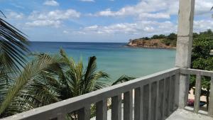 a view of the ocean from a balcony at Blue Ocean Hotel in Trincomalee