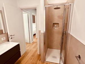 a shower with a glass door in a bathroom at Appartamenti Colombo in Arma di Taggia +45 photos