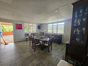 a dining room with a table and chairs at Spacious Beachfront Escape at Playa Guayanes for Large Groups in Yabucoa