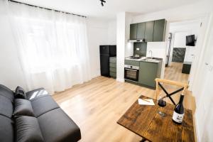 a living room with a couch and a table at Residenza Ximenes in Palermo