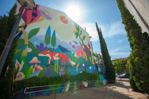 a mural painted on the side of a building at Travessa in Lisbon