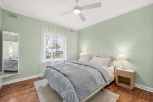 a white bedroom with a bed and a window at The Retreat, Barossa Valley in Lights Pass