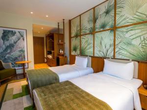 a hotel room with two beds and a couch at ibis Styles Istanbul Kurtkoy in Istanbul +74 photos