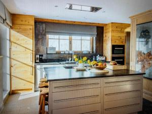 a kitchen with a counter with fruits on it at Valley View Residence in Sankt Anton am Arlberg +11 photos