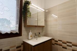 a bathroom with a sink and a mirror at Villa Lito in Litochoro +24 photos