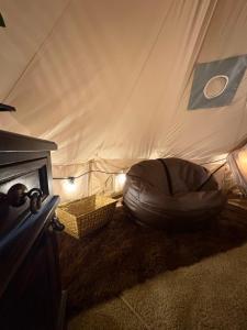 a bean bag chair sitting inside of a tent at Senda del Cielo in Villa Nueva