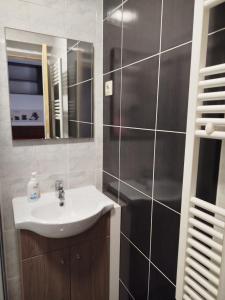a bathroom with a sink and a mirror at Casinha de Lamares in Vila Real +21 photos