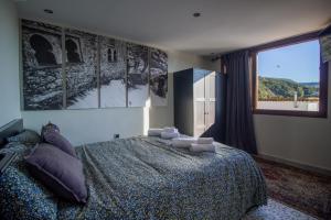 a bedroom with a large bed and a large window at Alojamientos Chaouni in Chefchaouen