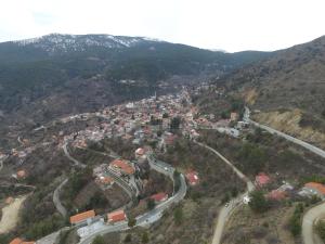 an aerial view of a town on a mountain at Christys Palace Hotel in Pedoulas