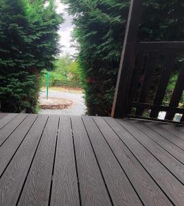 a wooden deck with an open door in a yard at Iona in Blessington