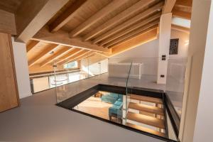 a glass box in the middle of a room at Echo - Private Spa Apartments in Ponte di Legno +73 photos