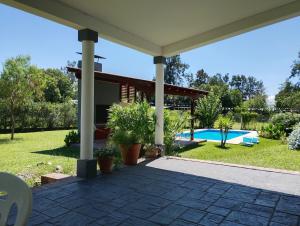 a patio with a pavilion and a swimming pool at El Prado Chico, Casa de Campo in Salta +17 photos