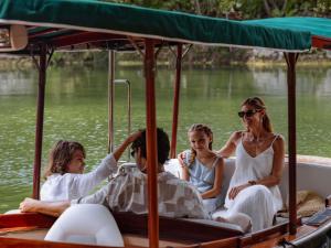 a group of people on a boat on the water at Fairmont Mayakoba in Playa del Carmen