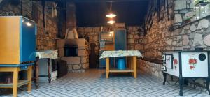 a kitchen with a counter and a stove in a room at Patakparti Pihenő in Cserépfalu