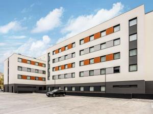a car parked in front of a building at ibis Madrid Norte Las Tablas in Madrid +92 photos