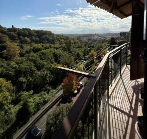 a balcony with a view of a road and trees at Alloggio turistico Brancaleone in Genazzano +6 photos