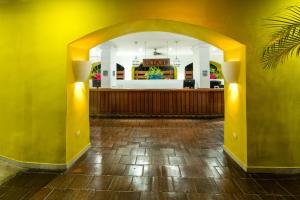 an entry way to a restaurant with an archway at Decameron Galeon - All Inclusive in Santa Marta +30 photos