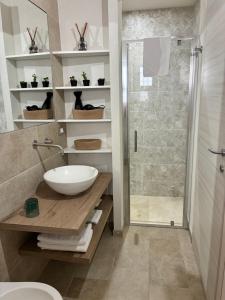 a bathroom with a sink and a shower at Siculía in Noto