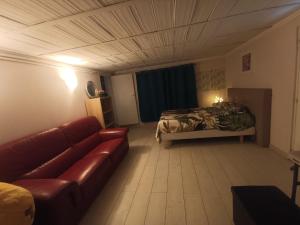 a living room with a couch and a bed at Charming House with Private Pool Near Paris - Maison du Bonheur in Gournay-sur-Marne +36 photos