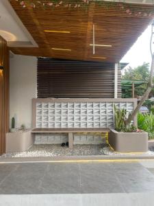 a bench in front of a building at Willow House in Padalarang
