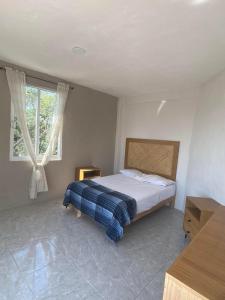 a bedroom with a bed and a window at 6-Private Pool and View of Lake Chapala in Chapala +88 photos