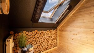 a sauna with wooden walls and a window at Strandurlaub Baabe - Bade- & Saunawelt täglich inklusive in Baabe +23 photos