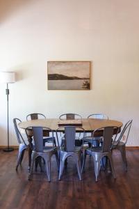 a group of tables and chairs in a room at Wilderness West Resort Cabin 5 in Colville +16 photos