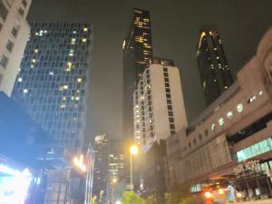 a city street with skyscrapers at night with at Soho Suites Kualalampur by homestay klcc in Kuala Lumpur