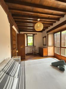 a bedroom with a bed in a room at Explora Picos de Europa in Cosgaya +63 photos