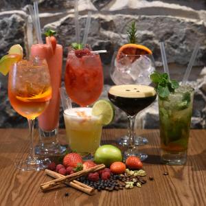 a group of drinks on a wooden table at The Coach House Hotel in Oranmore +28 photos