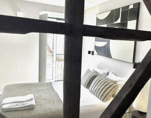a bedroom with a bunk bed in a room at Bairro House Lisbon Charming Suites in Lisbon